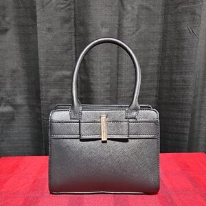 Handbag with bow and gold accents